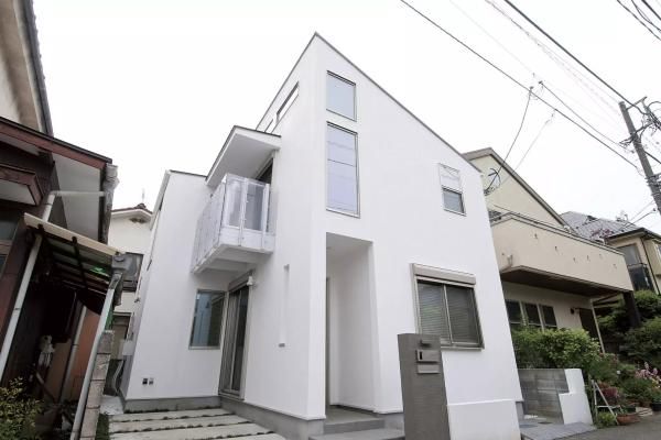 吹抜で離れたり繋がったりする家